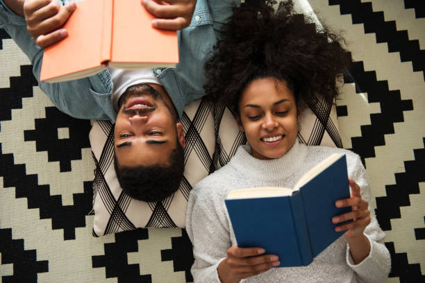 man and woman reading books
